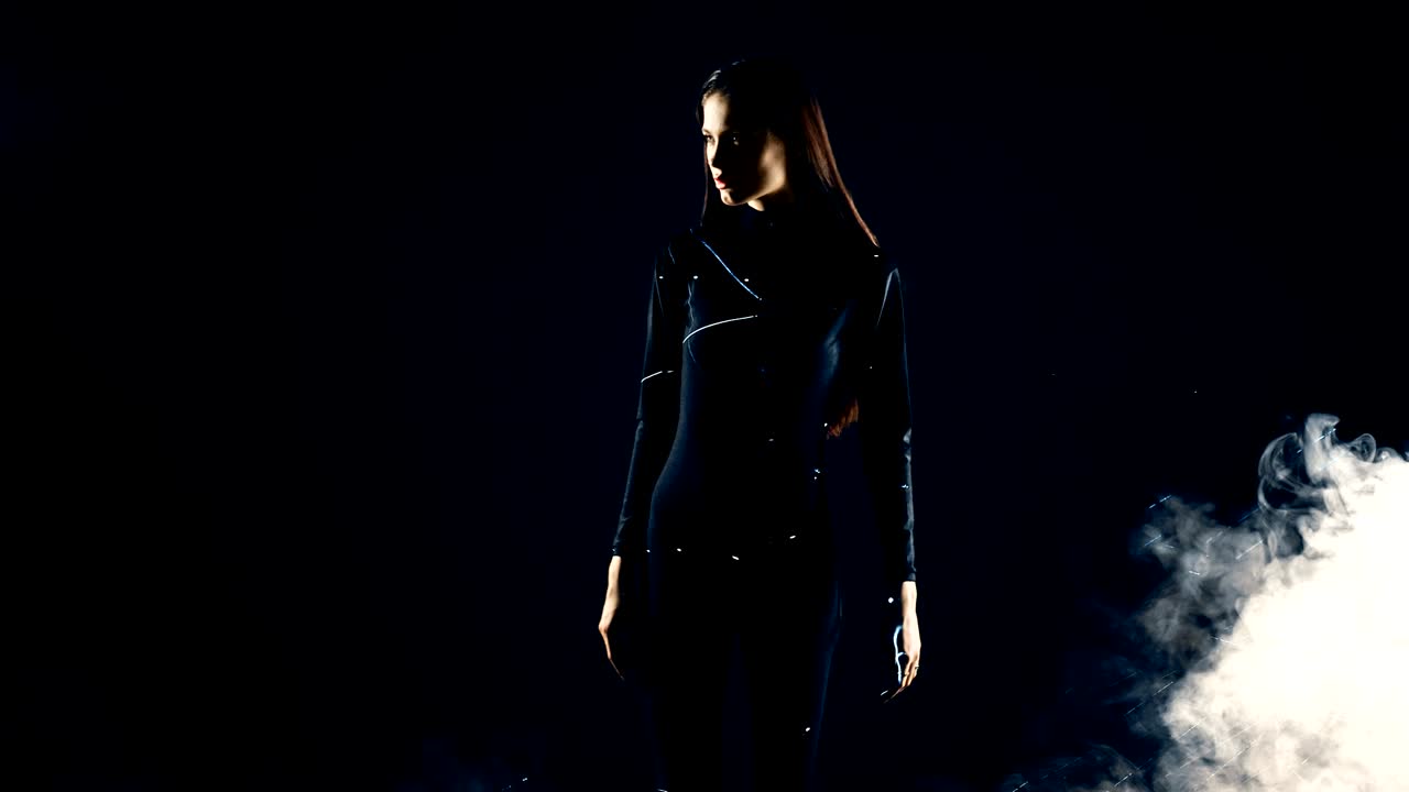 Stylish fashion girl futuristic technology black background cinematic lighting with smoke and backlight effect.Prores