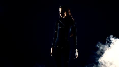 stylish fashion girl futuristic technology black background cinematic lighting with smoke and backlight effect.prores