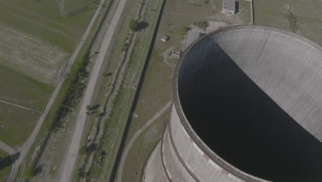 Aerial-descending-shot-overhead-a-chimney-at-a-power-plant