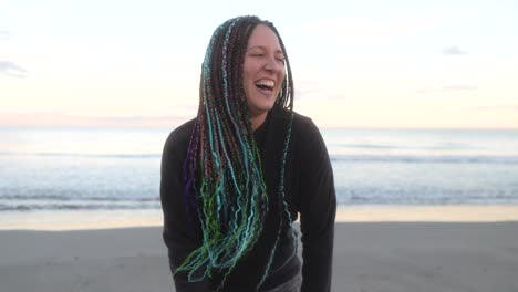 woman with braids smiles tired after running