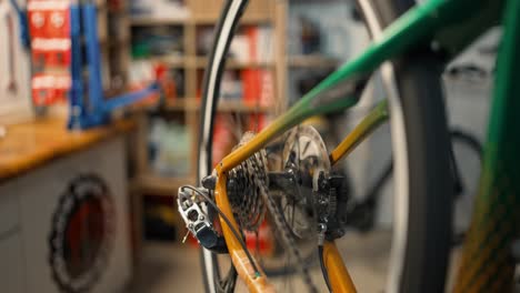 Rotating-bicycle-chain-and-gears-to-test-bicycle.-Cycling-workshop