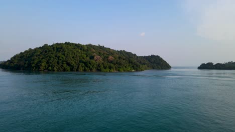 Uninhabited-tropical-island-near-coastline-of-Indonesia,-aerial-drone-view