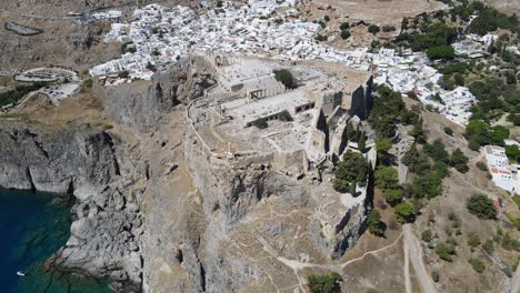 dynamic drone shot of the acropolis of lindos on the island of rhodes, greece