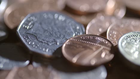 harshly lit rotating coins