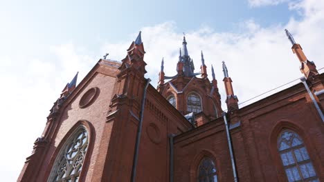 exterior of a red brick gothic church