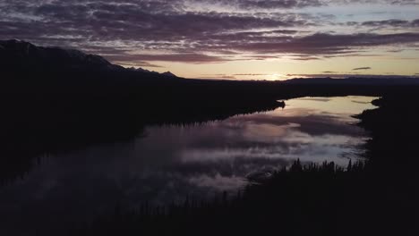 Slow-aerial-movement-over-Lower-Kathleen-Lake-in-Yukon,-Canada-at-sunset