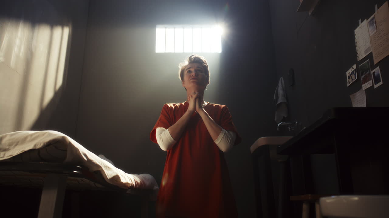 Female Inmate Begging God for Forgiveness during Prayer in Prison Cell