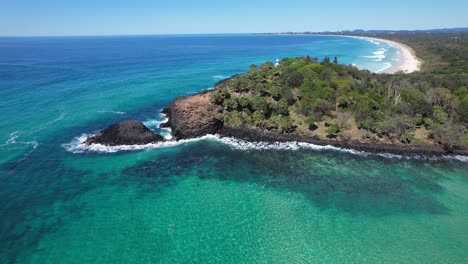 turquoise ocean at fingal headland in new south wales, australia - aerial shot