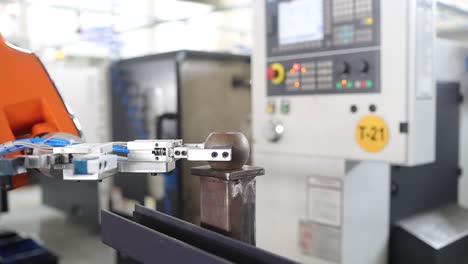 robotic arm taking a ball part in the machine insert, industry 5.0, industrial 4.0 concept