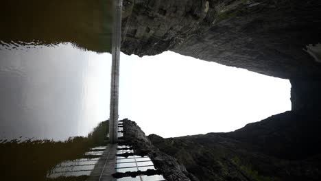 stunning cliffside architecture with water reflection