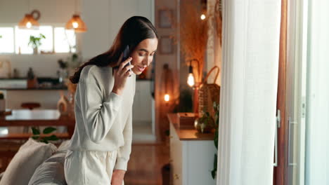 woman talking on phone at home