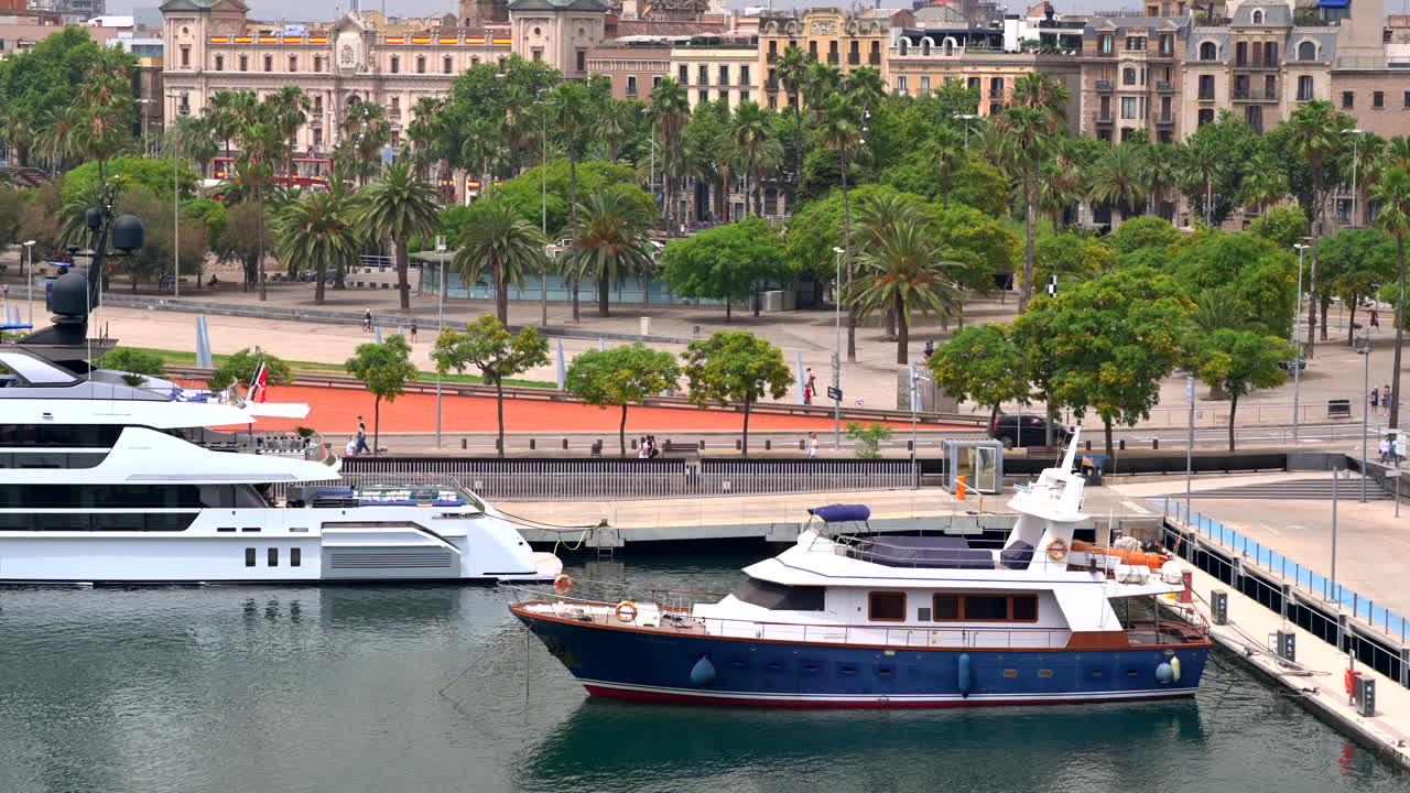 Aerial drone view of boats docked in the Port Vell in Barcelona, Spain