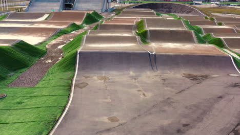 Empty-outdoor-BMX-track-in-aerial-dolly-in-shot