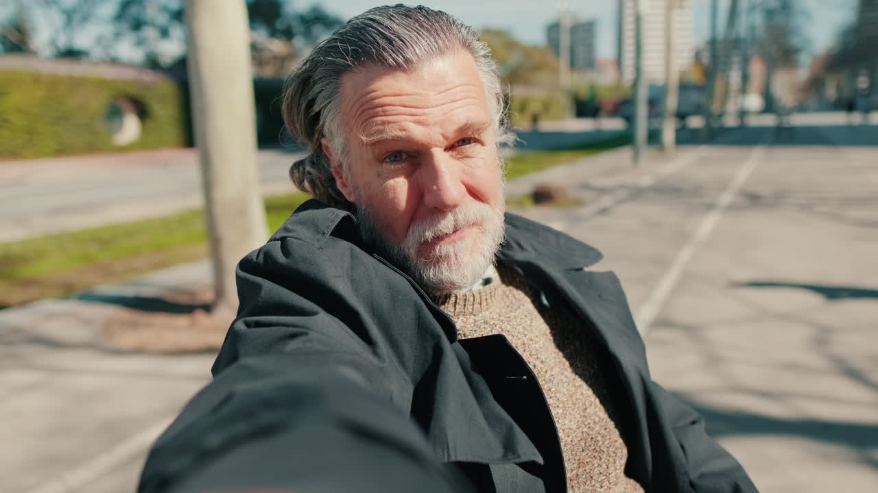 Happy Senior Man Taking a Selfie Video in the Park