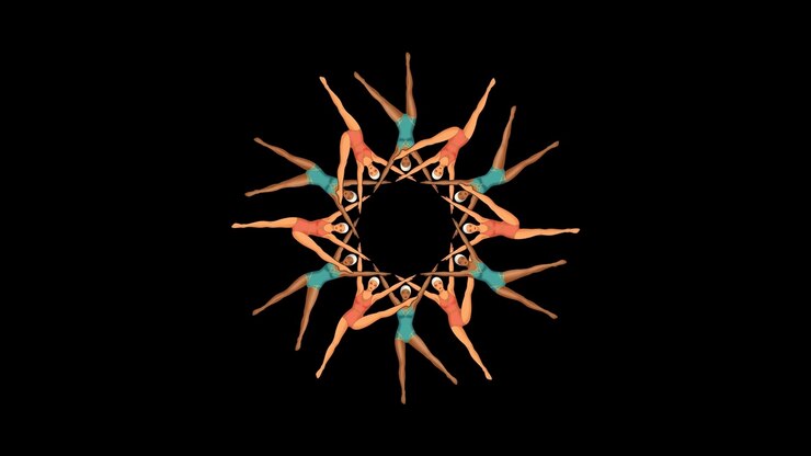 Group of Dancers Performing Synchronized Choreography in a Circle
