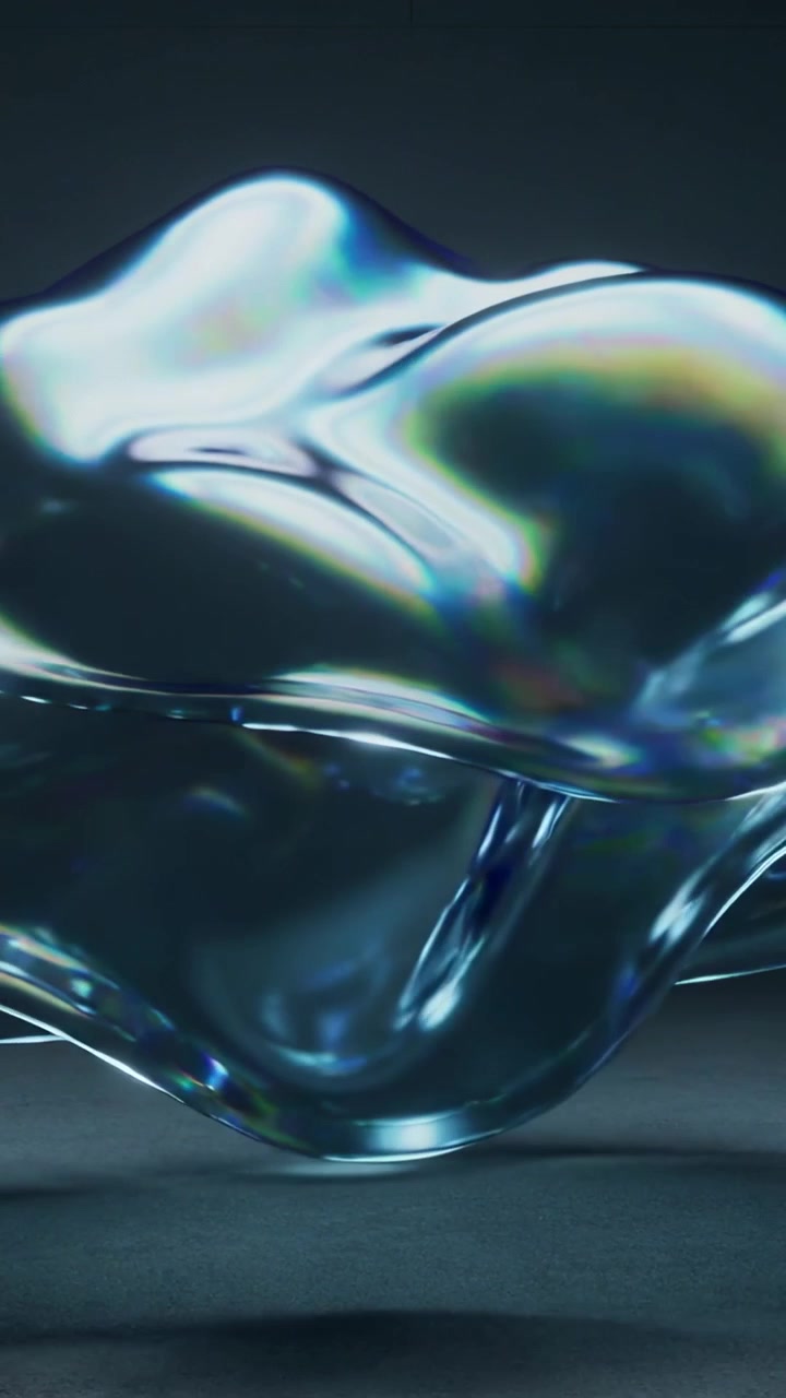 Vertical video: Shifting bulge causing glossy blob waving on studio base, showing pendant droplets