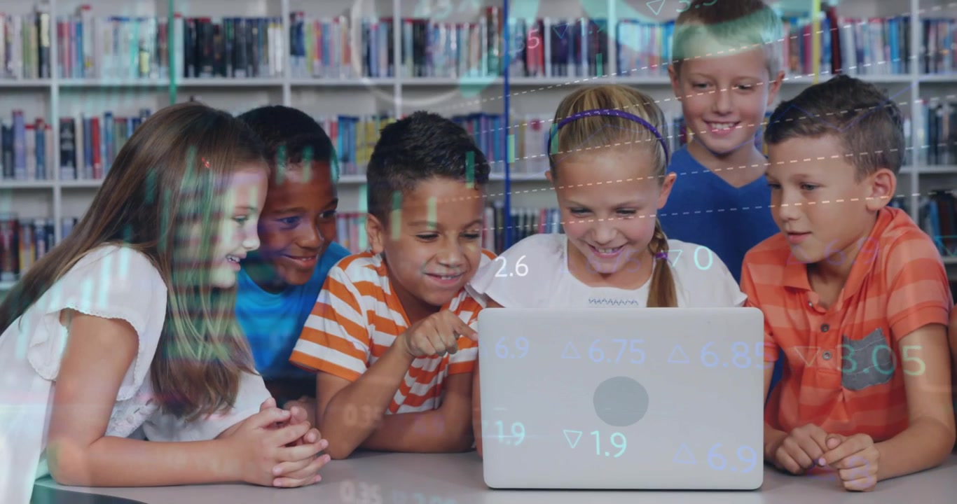 Diverse Group of Children Using Laptop in School Library