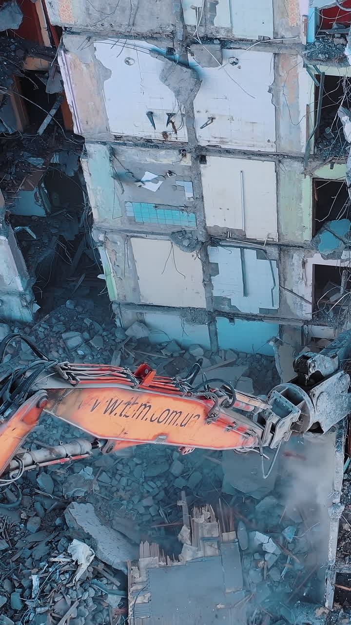 Destroying old building. Destroying large old house with special machine