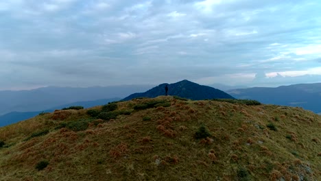 the man standing on the mountain