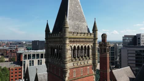 aerial drone flight slowly circling the clocktower of manchester crown court