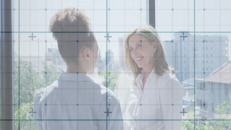 in office, women working with data grid animation overlaying workspace