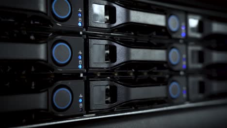 handheld close-up of active server lights in data center, modern tech infrastructure in 4k