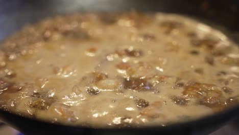 Bubbling-Sauce-Simmering-Away-With-Prawns-Floating-On-Top