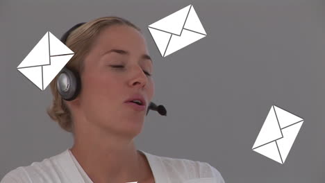 Animation of emails icons over woman wearing phone headset
