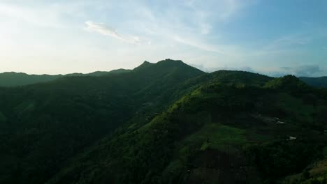 4K-Cinematic-nature-aerial-footage-of-a-drone-flying-over-the-beautiful-mountains-of-Chiang-Mai,-Thailand-during-sunset