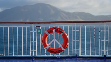 ferry lifebuoy with calm ocean and mountain view in new zealand