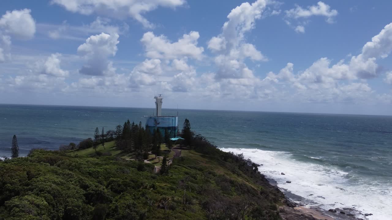 4K aerial drone shot of a peninsula flying towards a lighthouse in Australia