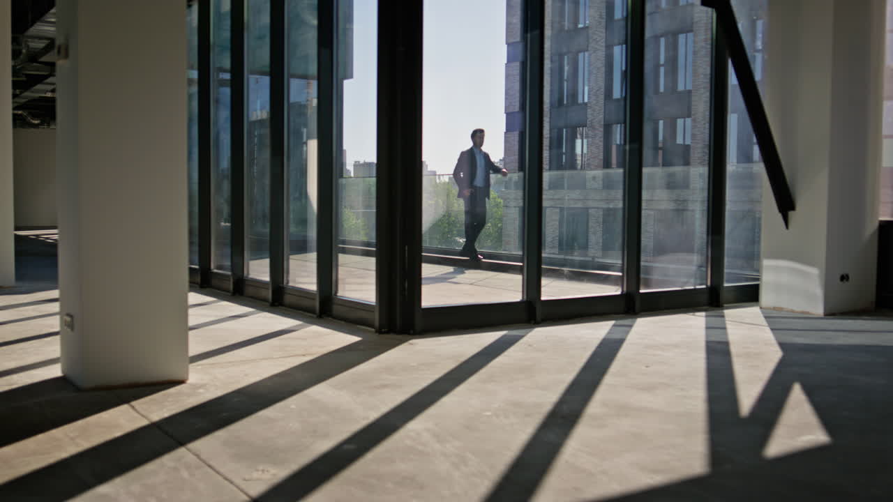 Silhouette director contemplating city alone. Company man in suit thinking life