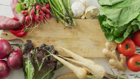 video of fresh vegetables with copy space over wooden background