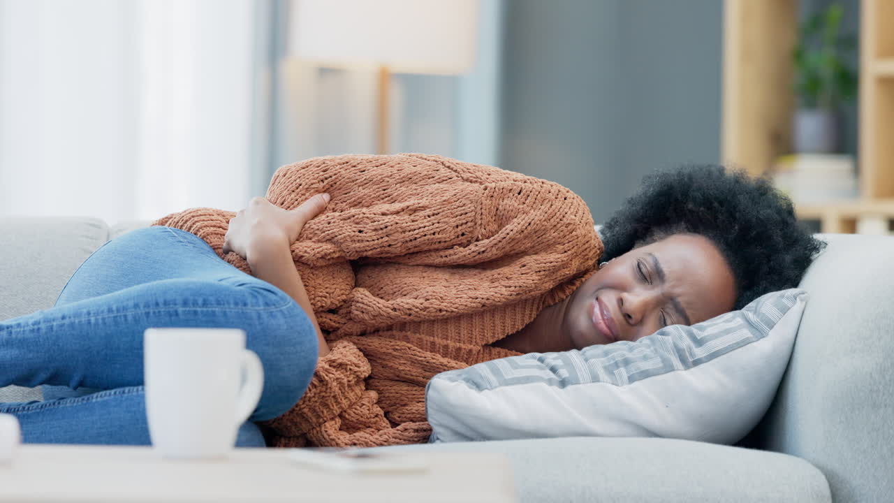 Woman with menstruation stomach cramps