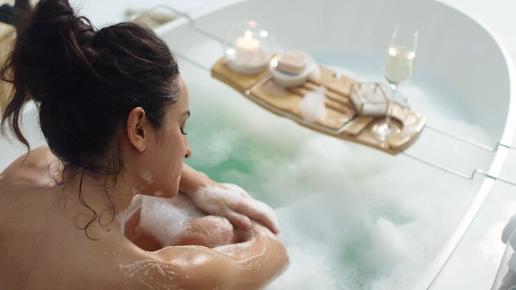 Close-up view of caucasian woman washing hands in luxury bathroom