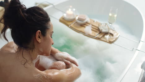 close-up view of caucasian woman washing hands in luxury bathroom