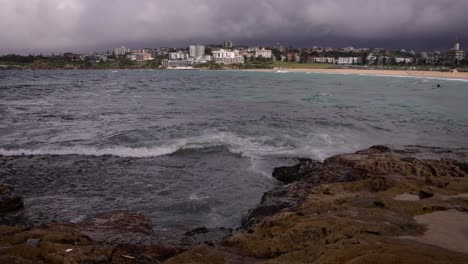 view looking south from north bondi beach on a rainy day, sydney, australia