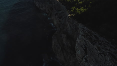 sunrise drone shot over the cliffs on the way to cap formentor, mallorca