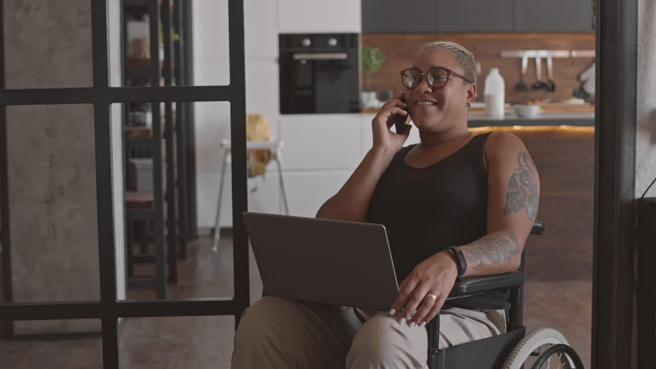 Businesswoman in Wheelchair Talking on Phone