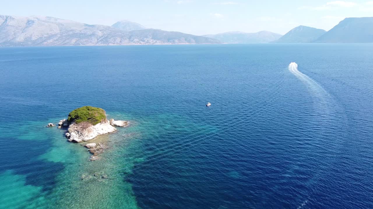 Boat Sails to Reef and Small Island near Meganisi, Lefkada, Greece - Aerial