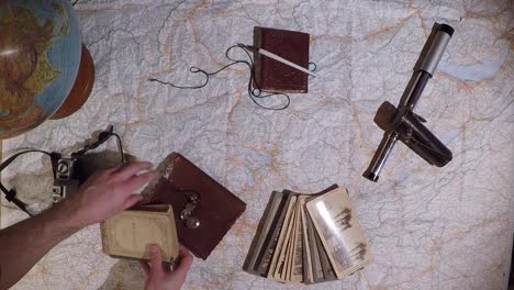 top down traveler's map, globe and vintage accessories on top