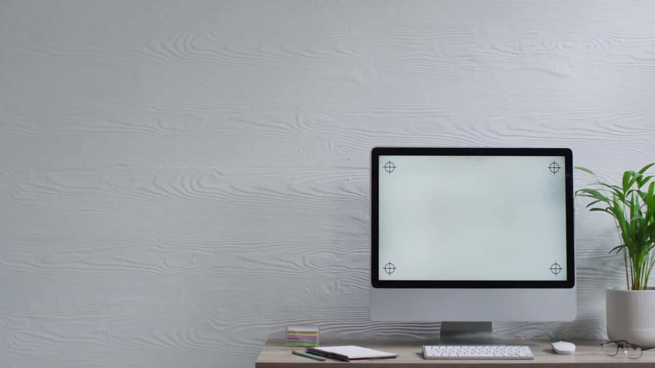 Video of computer on wooden table with copy space in office