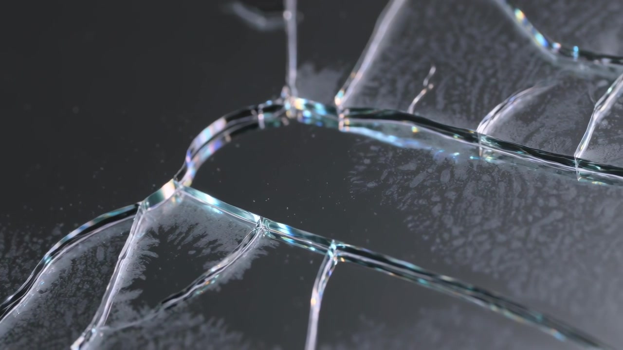 Shifting studio light causing cracked glass panel revealing radial fissures and iridescent glints