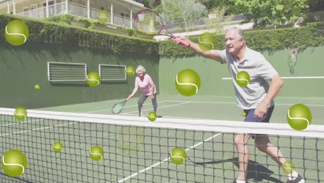 animation of tennis balls over happy senior caucasian couple playing tennis outdoors