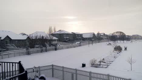 Dreary-snowy-day-in-a-suburban-neighborhood---backyard-view