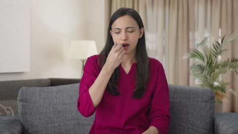 Indian-woman-checking-fever-using-thermometer