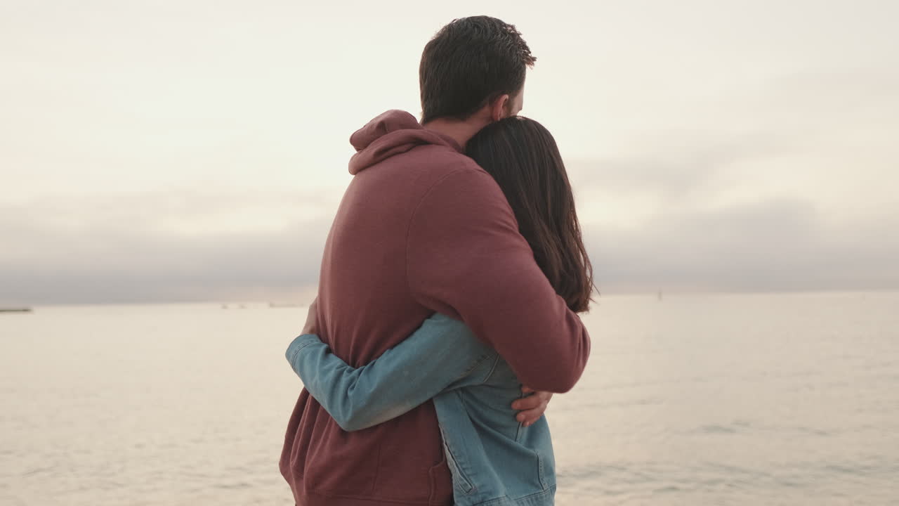 A Couple Enjoying a Romantic Moment at the Beach