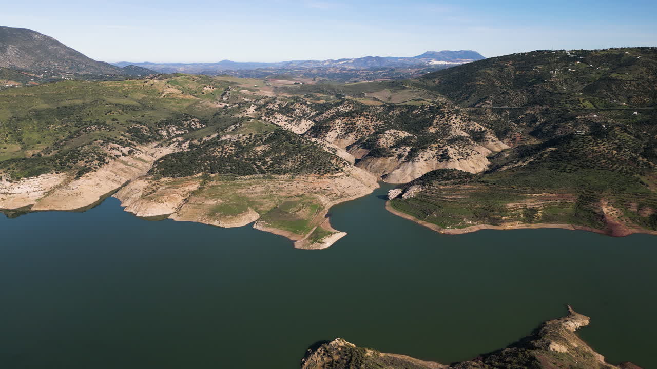 Drone pushing in over the Zahara-El Gastor Reservoir. Southern Spain.