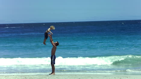 Father-throwing-his-son-in-slow-motion