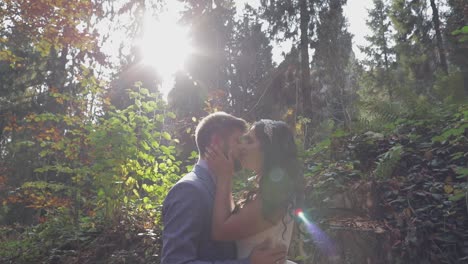 Groom-with-bride-near-mountain-hills-in-the-forest.-Wedding-couple.-Sunbeams